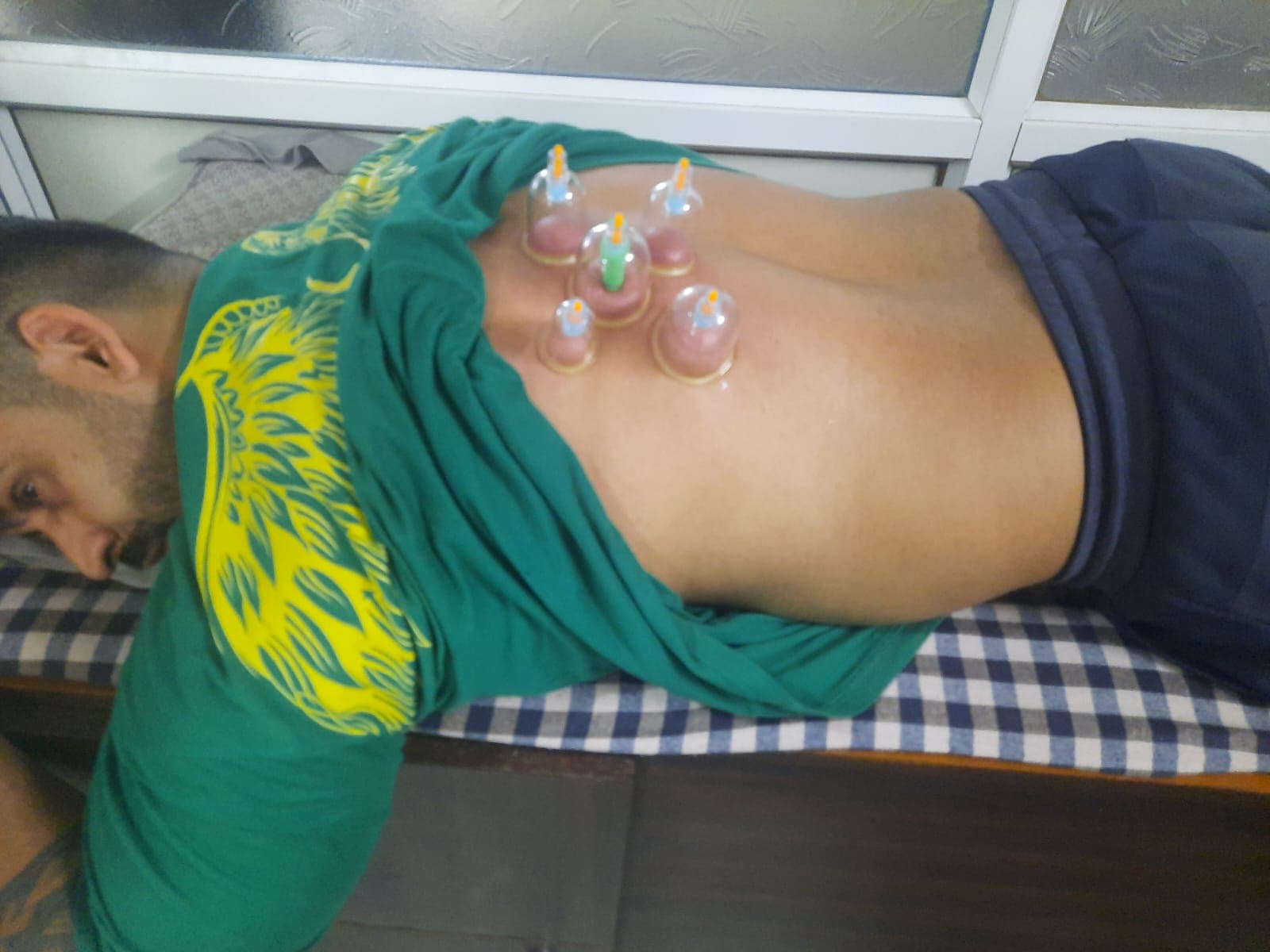 Physiotherapist treating knee patient